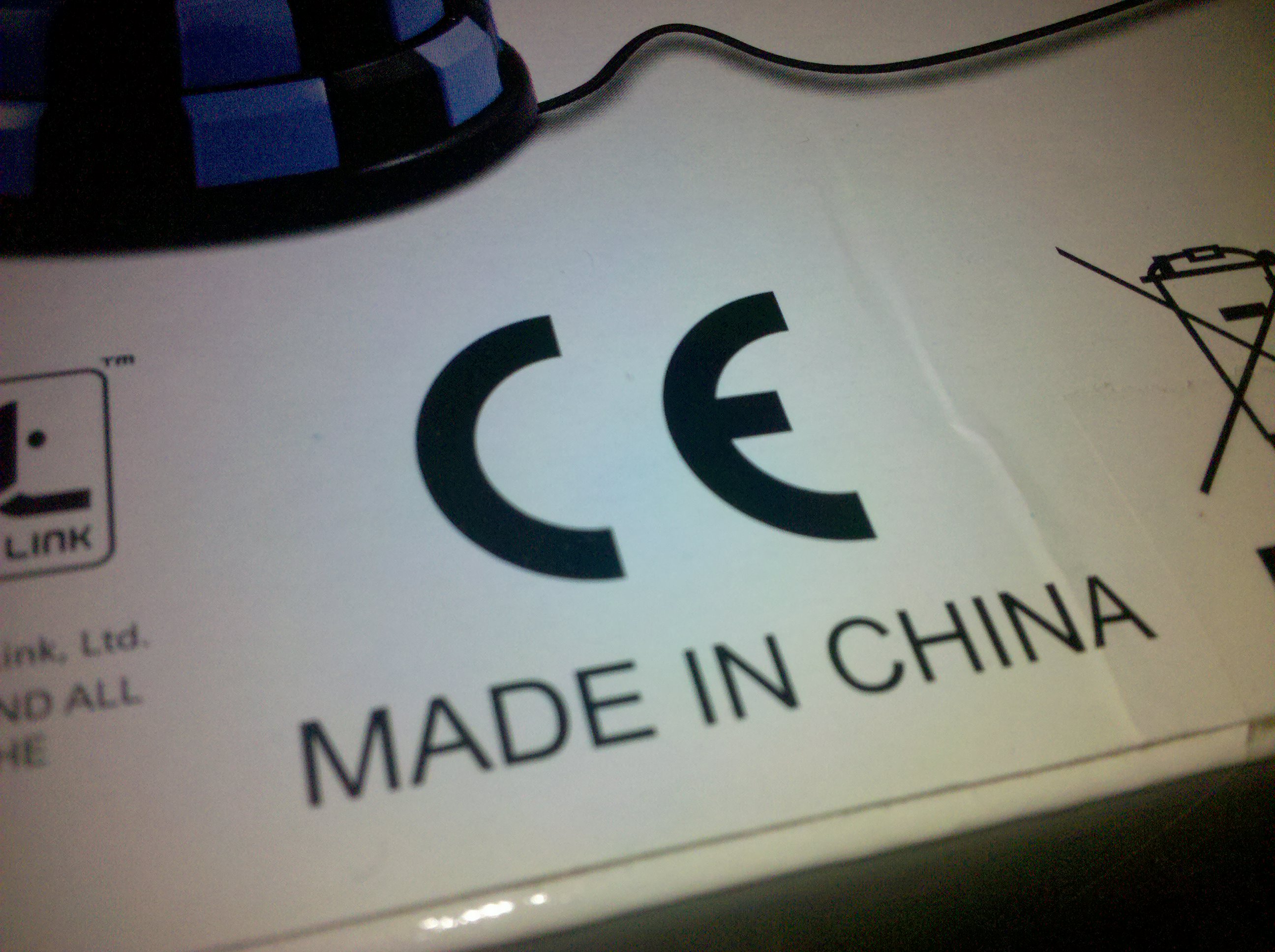 Close-up photo of product packaging showing a CE mark next to a Made in China origin label.